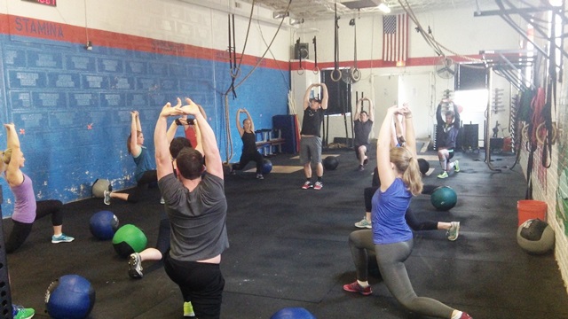 Coach Casey warming up Saturday morning class for 14.5 and Burpee Fran