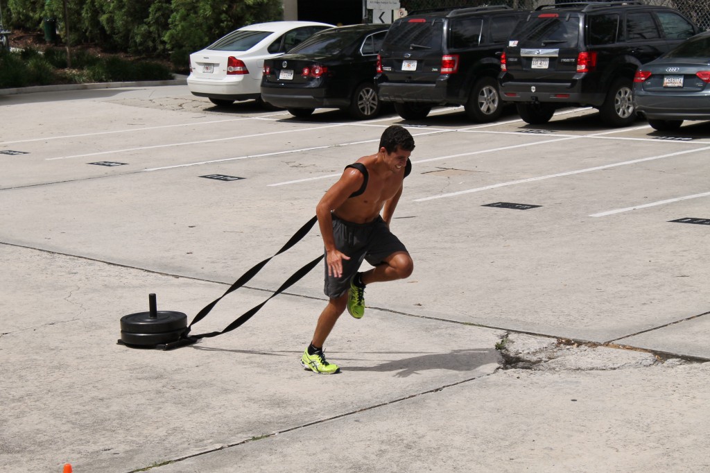 D.C. al Fine. Coach Jason Pulling the Sled to the finish line on the final WOD of the day.