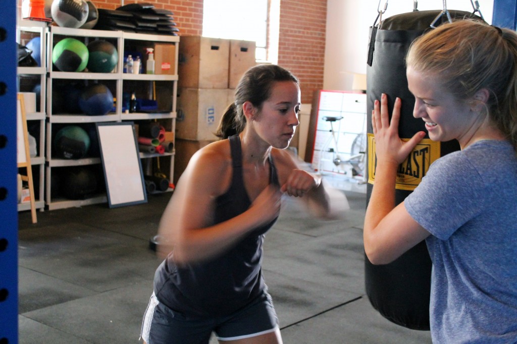 Hope and Heather. Heavy bag hitting for the Captain America WOD