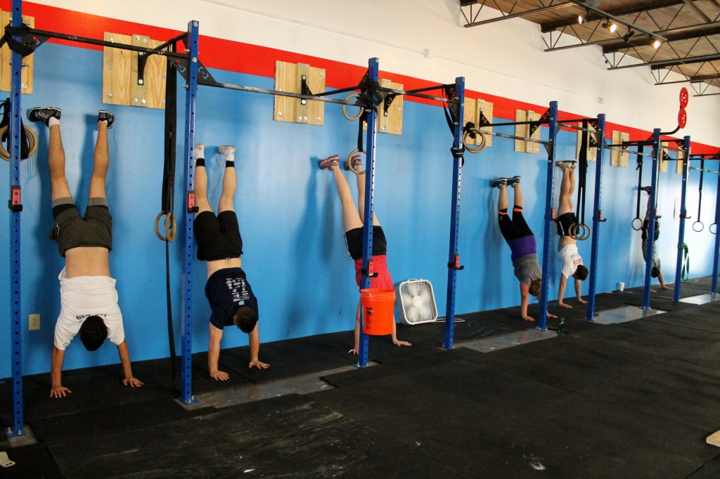 Handstand wall climbs into holds