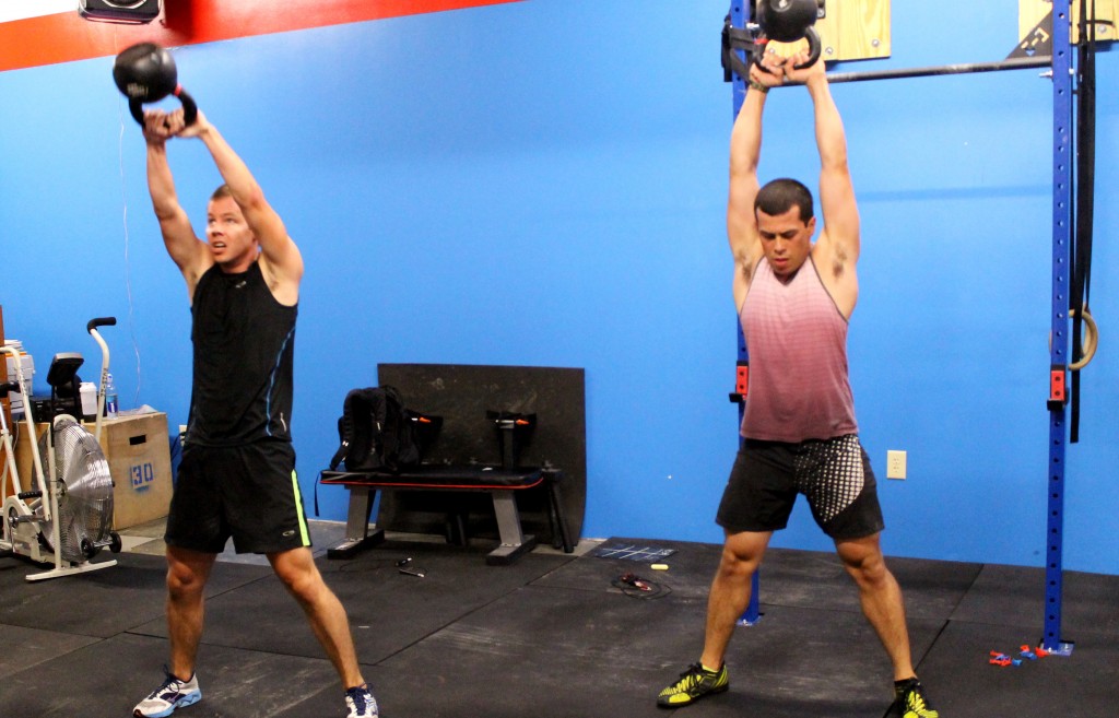 Cary and Ernesto matching kettlebell swings rep for rep.