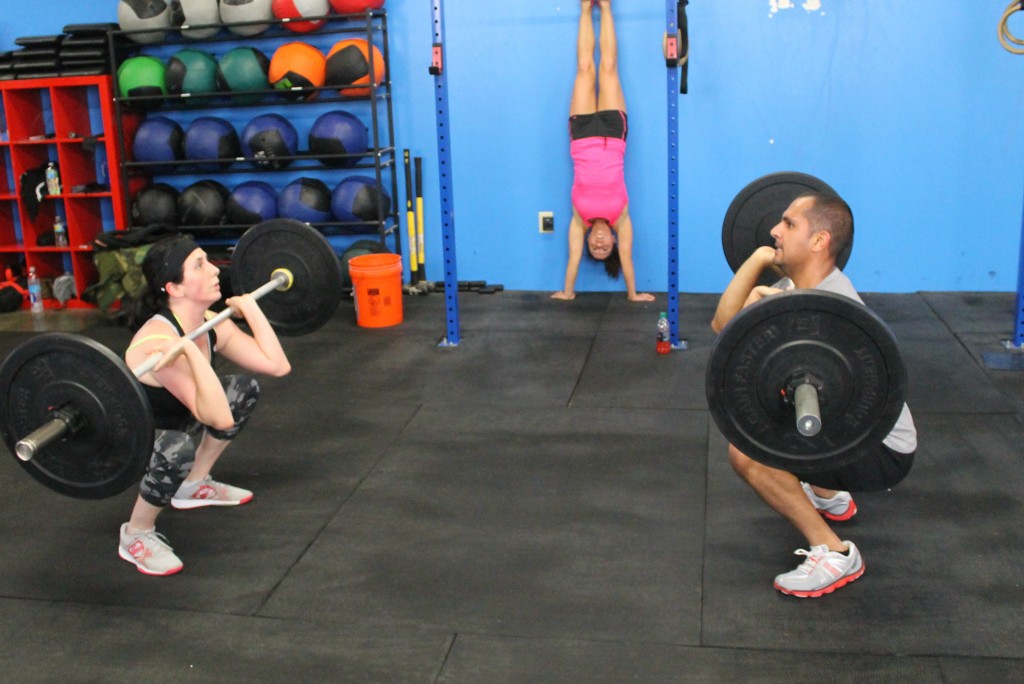 Front squats and partner handstand holds
