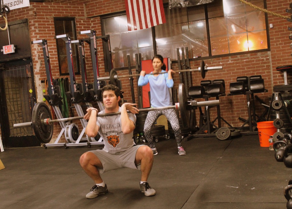 Rodrigo and Dobrinka keeping their elbows up on front squats