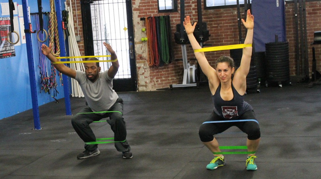 Terry and Sarah working on banded squats