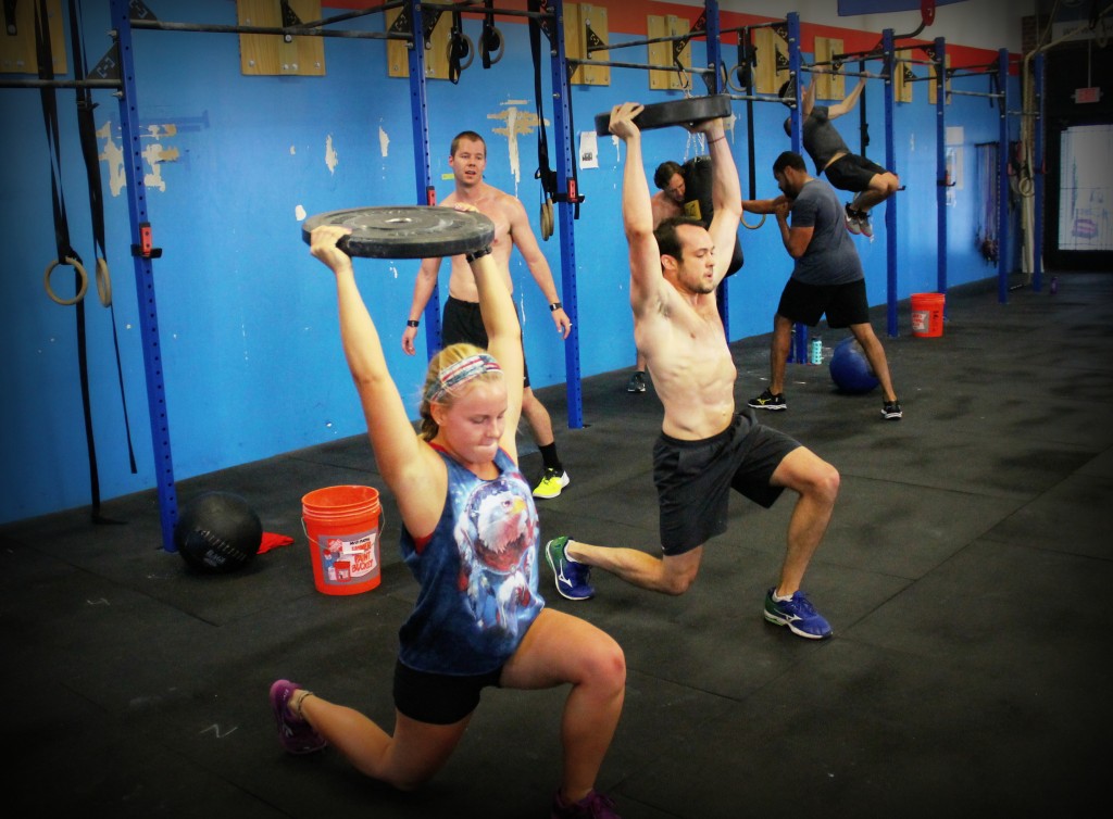 Overhead weighted lunges with Megan and Stewart.
